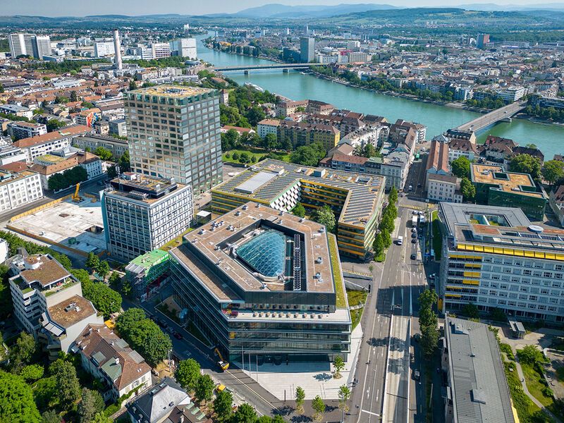 Drone view of the Basel City with a view on the Basel-Landschaft and the hills in the background